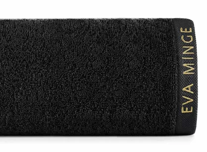 Ręcznik 30x50 VENUS Eva Minge czarny zdobiony bordiurą w kolorze ręcznika z napisami projektantki